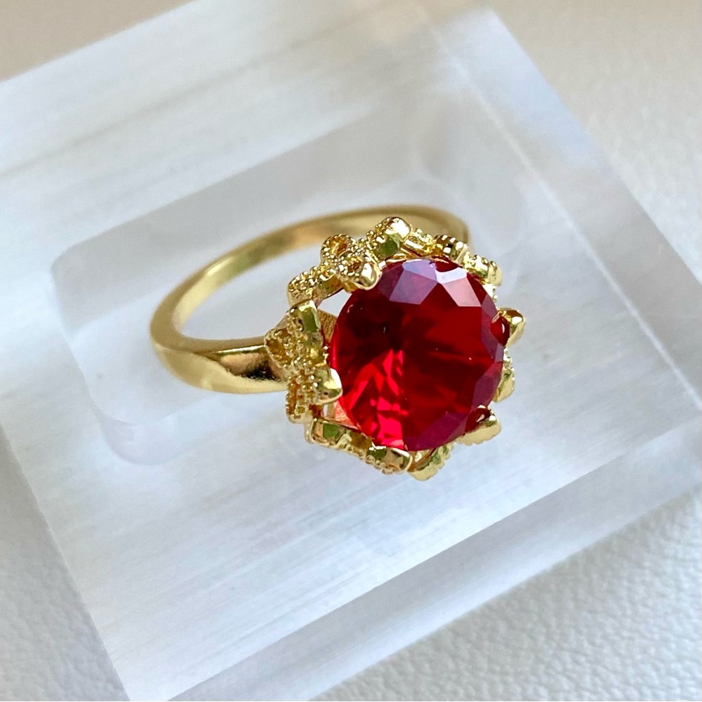Gold Ring with Red Crystal Center